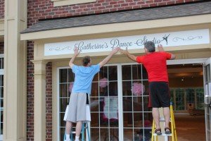Hanging the sign at Catherine's Dance Studio, 170 English Landing Drive, Suite 111 Parkville, MO 64152